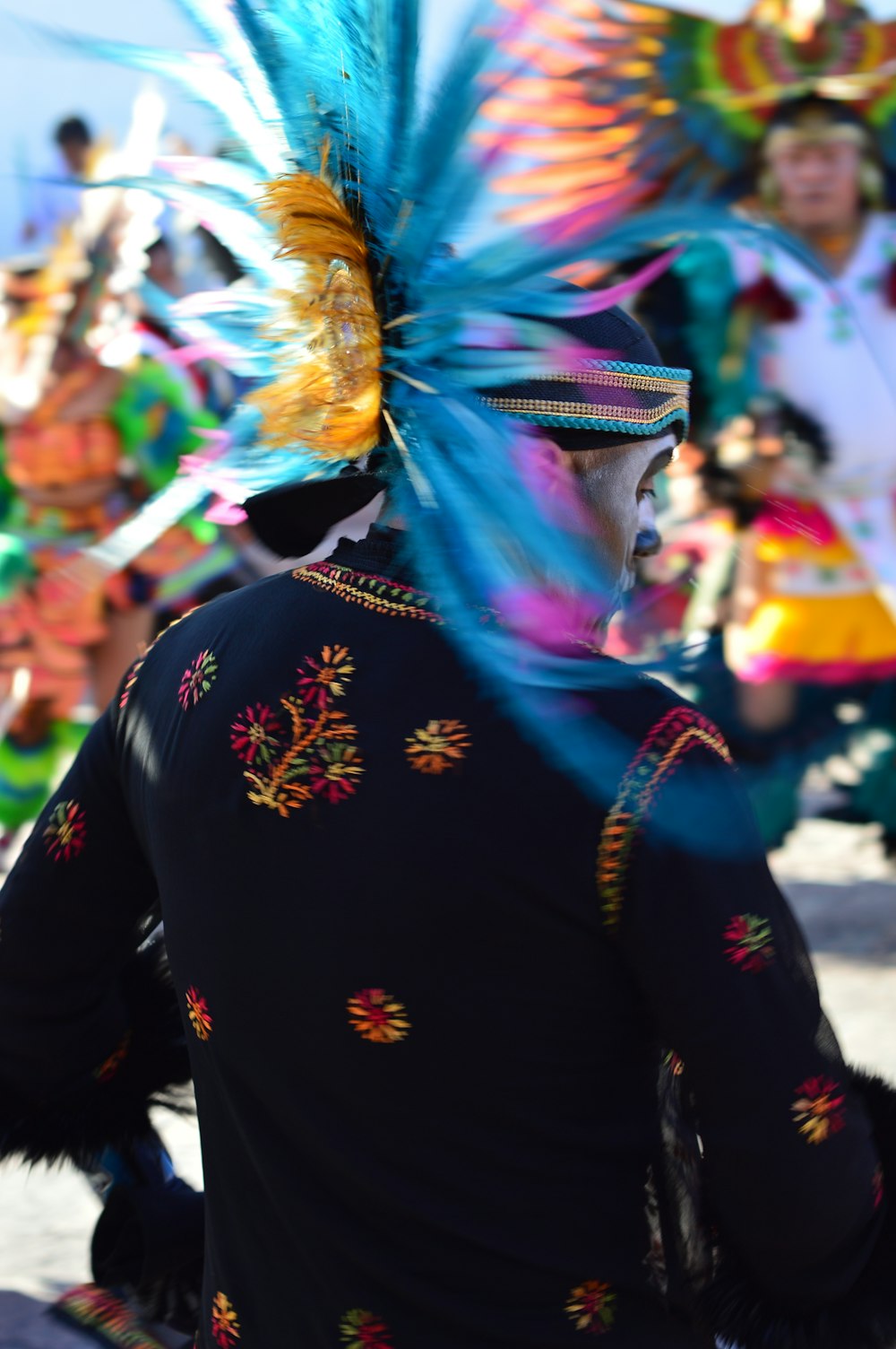 person in black blouse with headdress during daytime