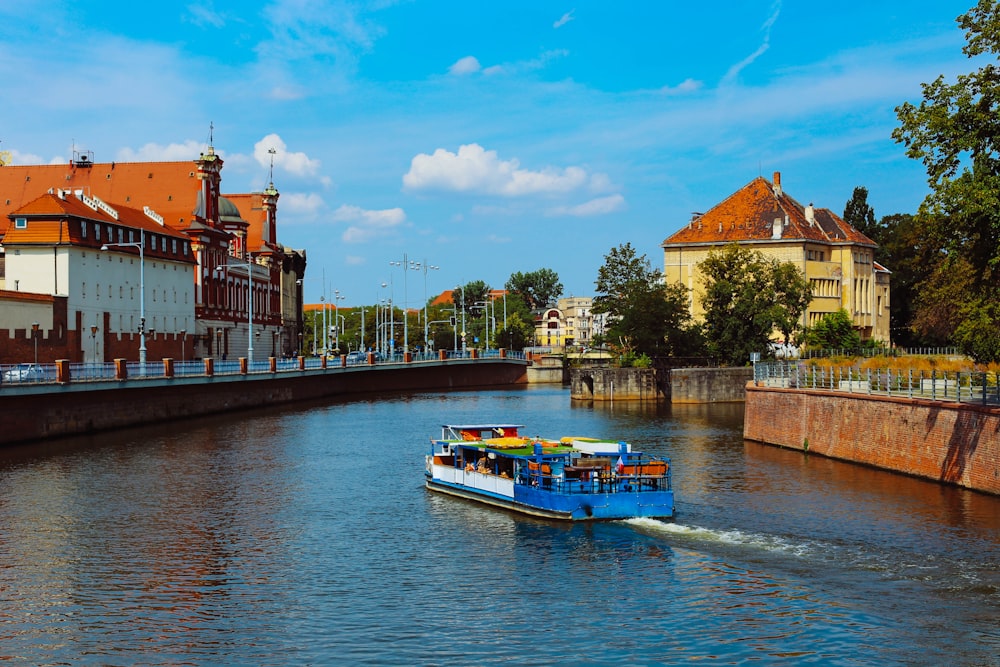 blue and yellow boat near road