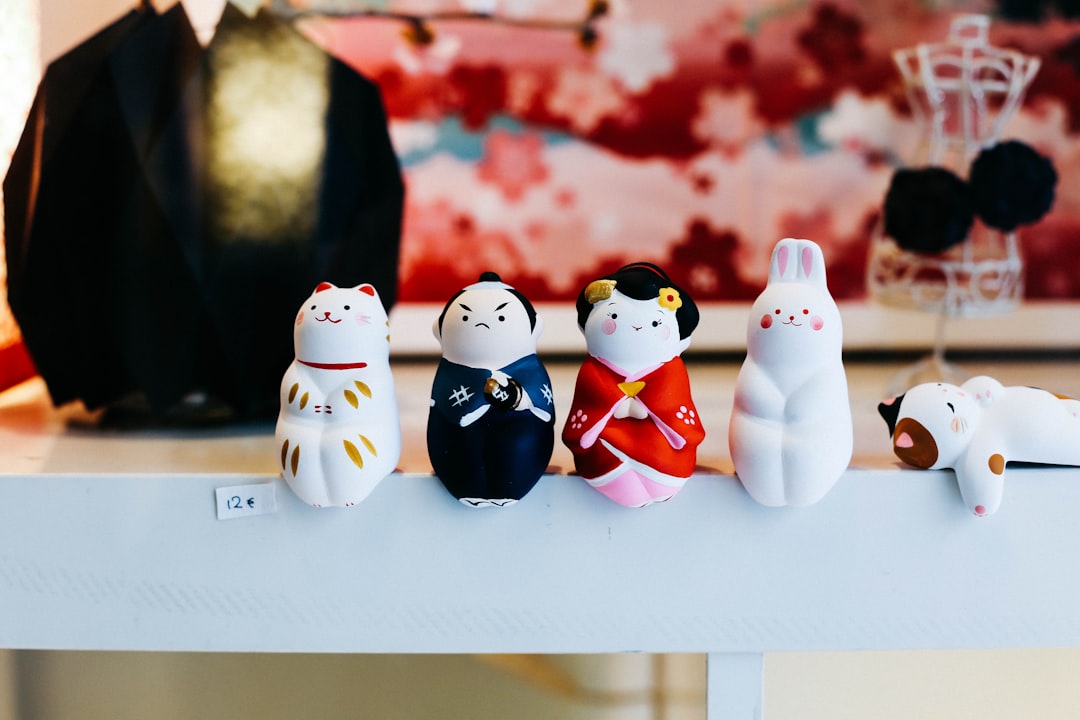 four assorted-color figurines