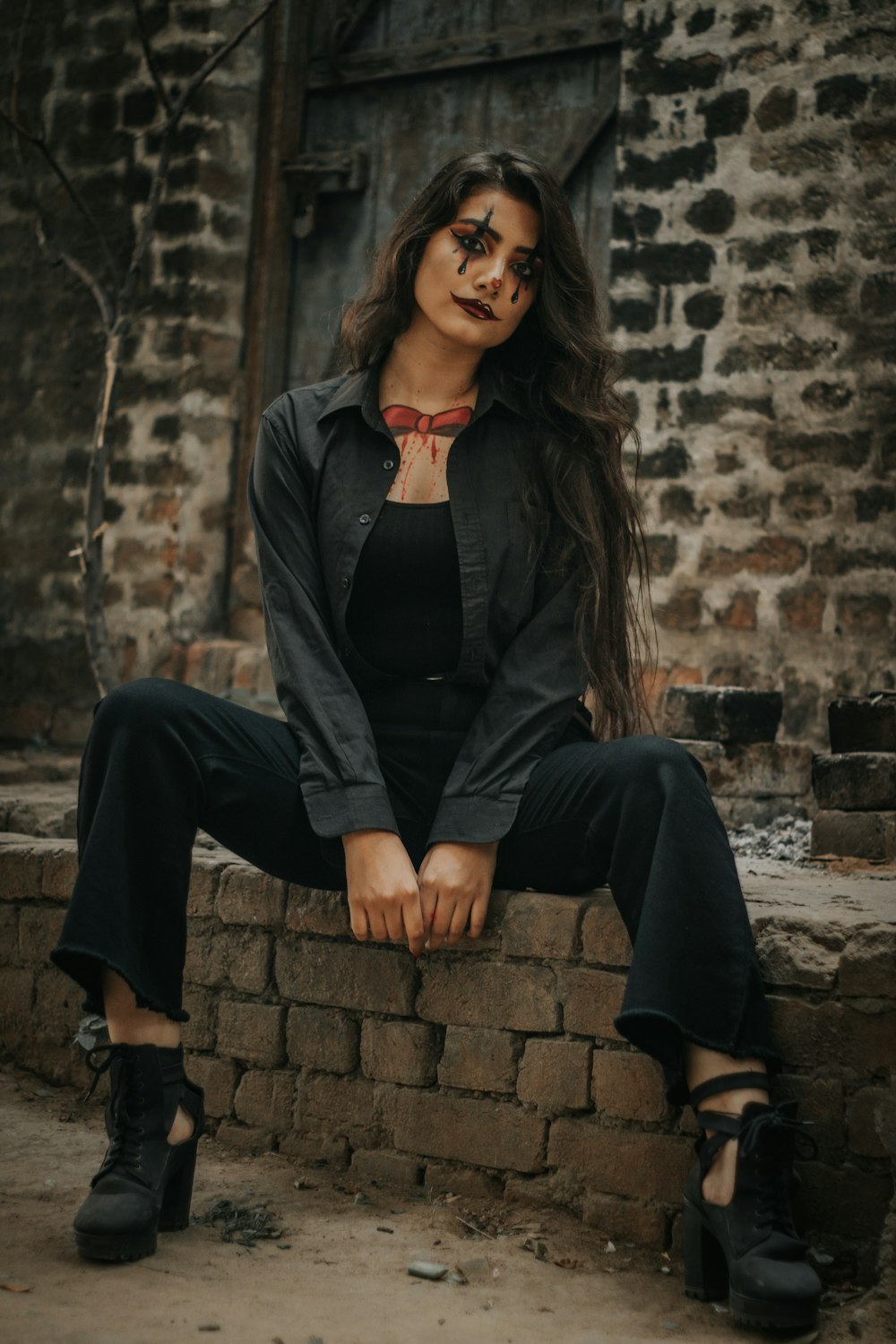 woman siting on concrete ground