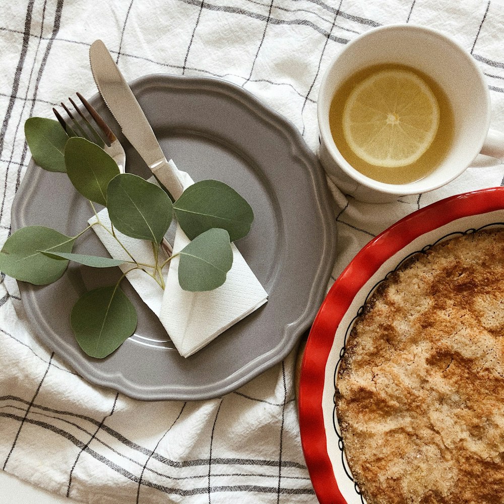 a pie and a cup of tea on a table