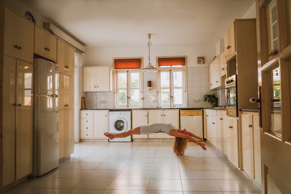 woman doing post inside kitchen