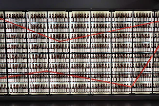 Professional team setting up premium beer displays in a high-end supermarket aisle.