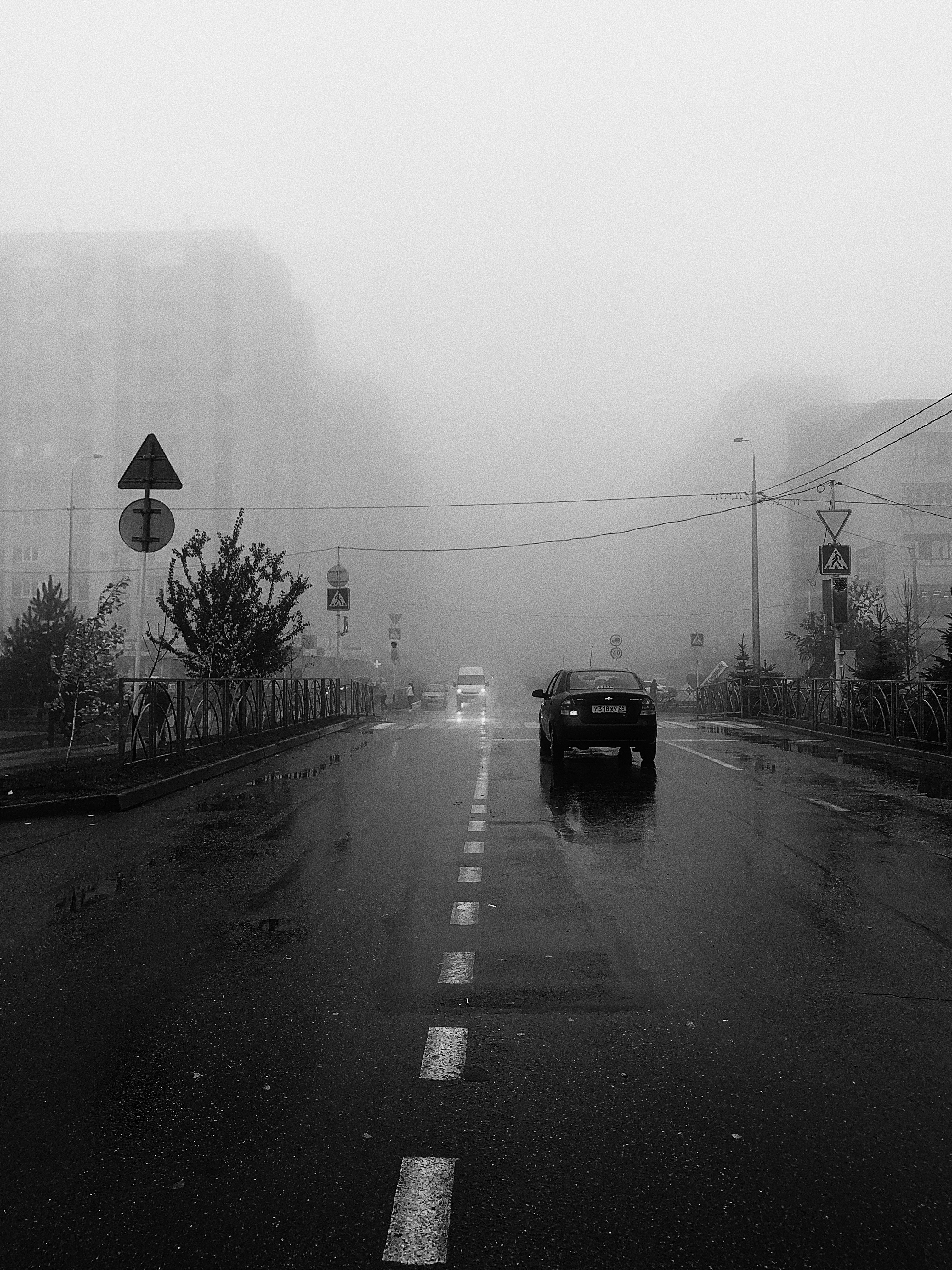 Grayscale photo of a road while raining photo – Free Grey Image on Unsplash