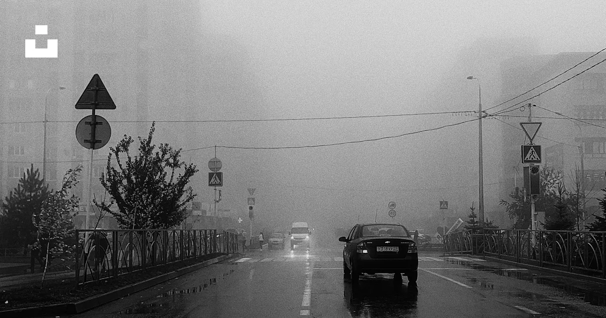Grayscale photo of a road while raining photo – Free Grey Image on Unsplash