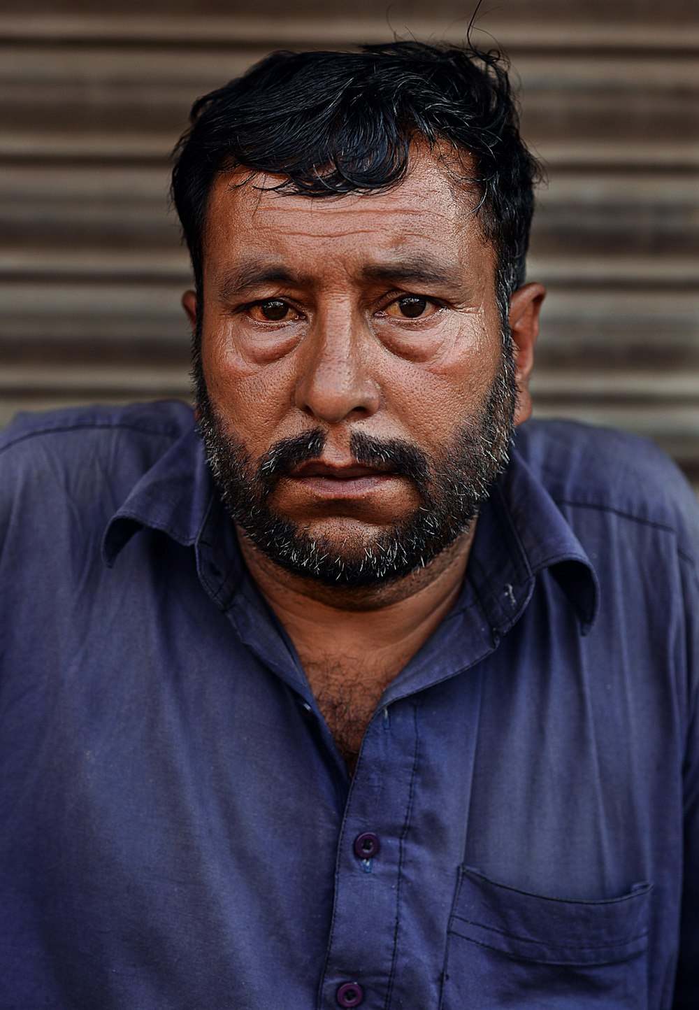 man wearing blue collared shirt