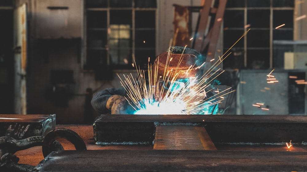 person using welding machine