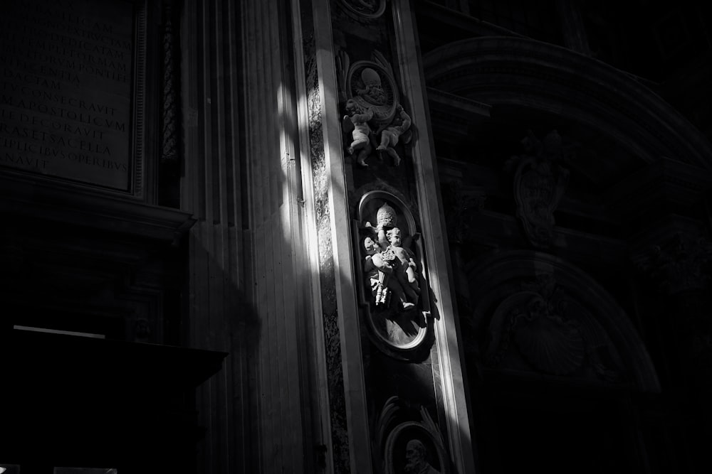 a black and white photo of a clock in a church