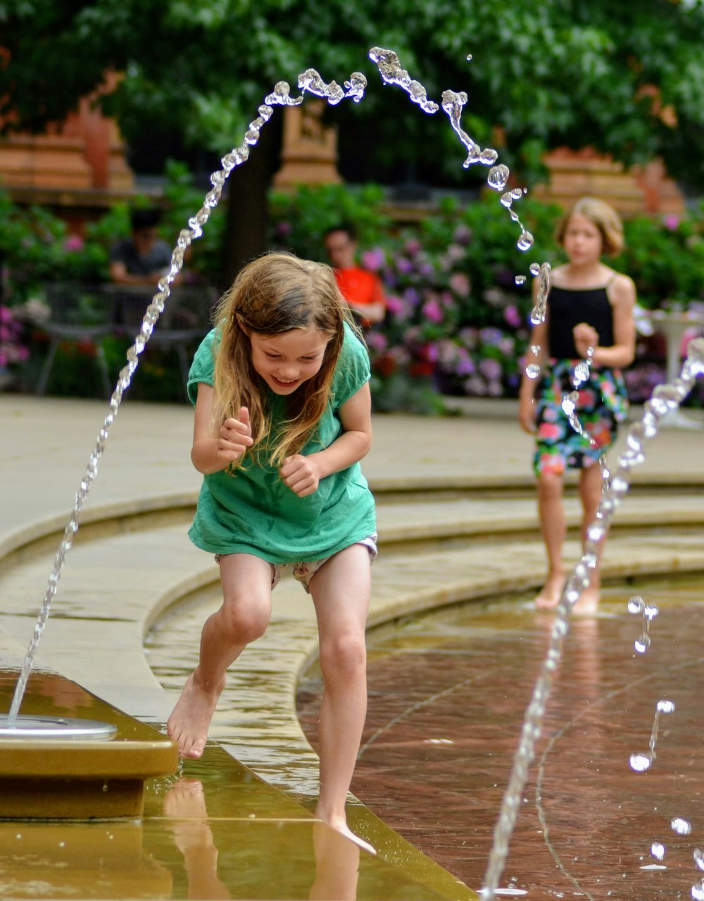 girl near outdoor fountain