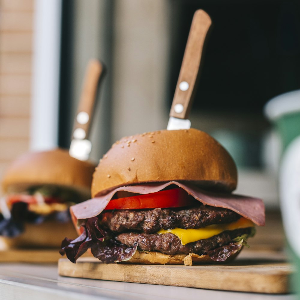 cheeseburger on a wooden tray