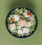 green salad on a black bowl