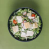 green salad on a black bowl
