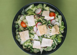 green salad on a black bowl