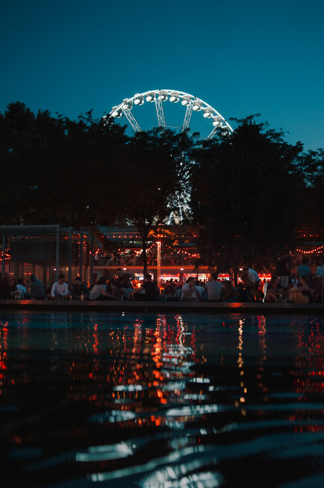 people sitting near body of water