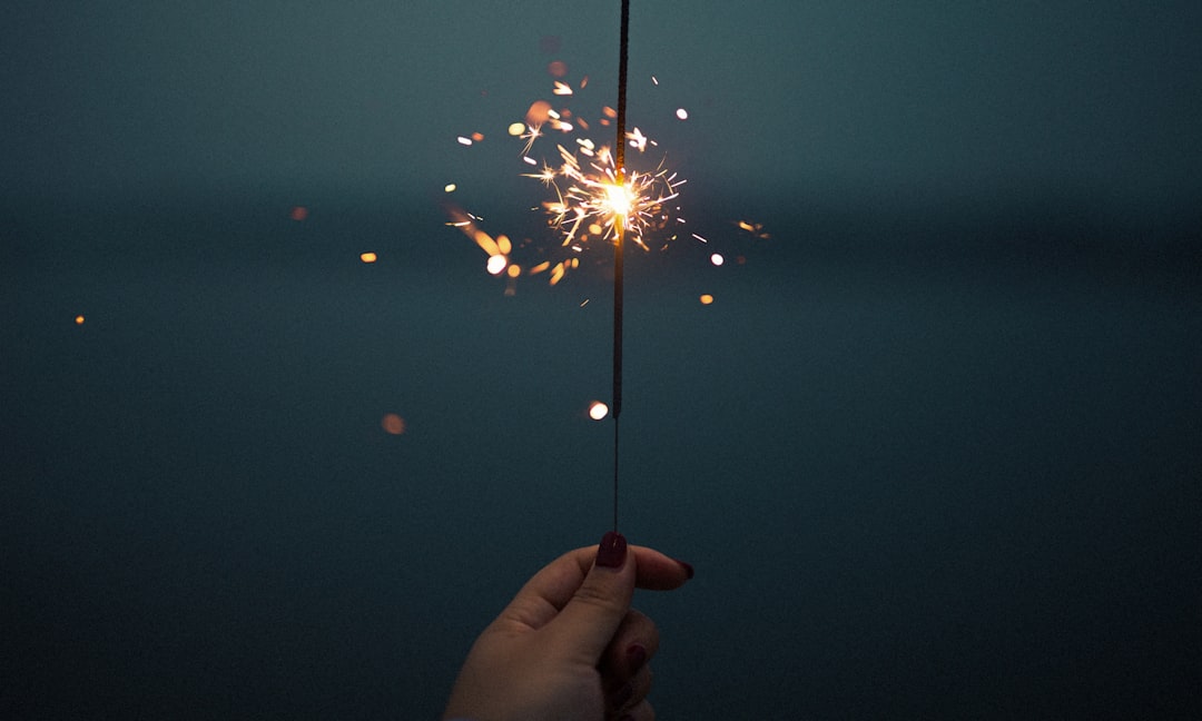 person holding sparkler