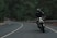 man riding motorcycle on concrete street