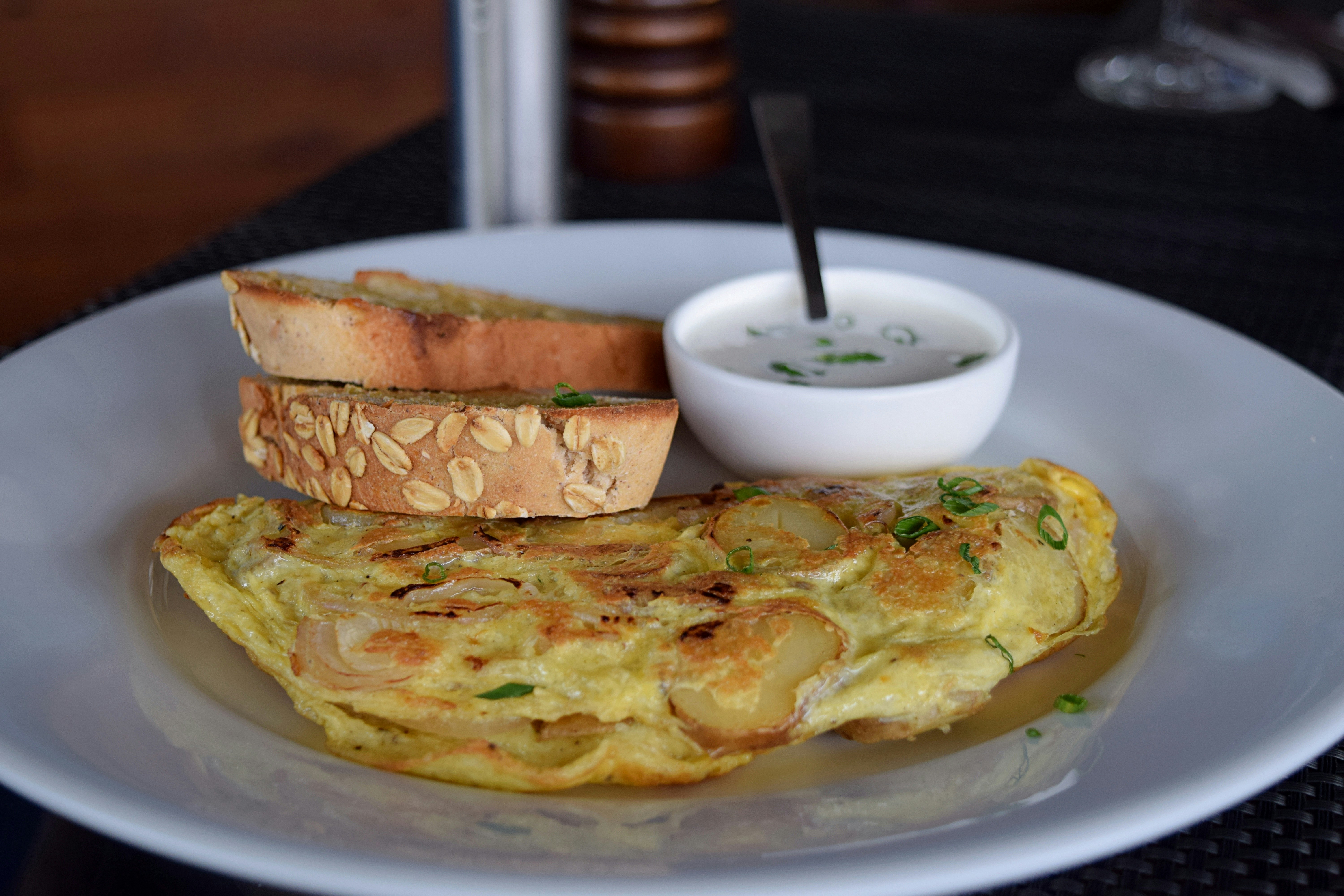 cooked omelette and bread