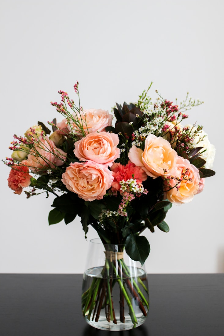 Peach garden roses in a hand-tied bouquet