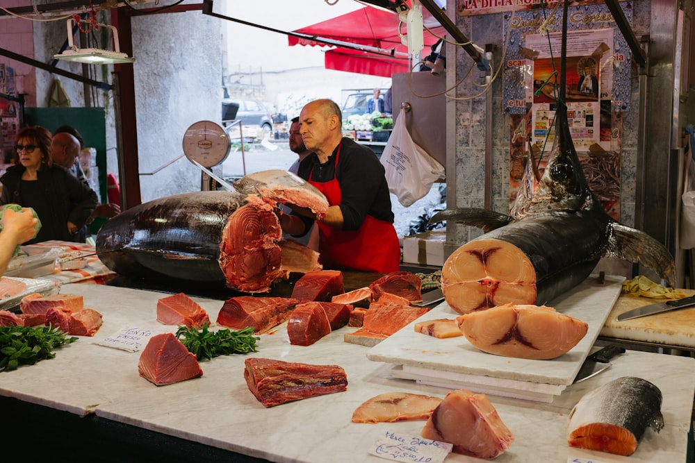 man slicing fish