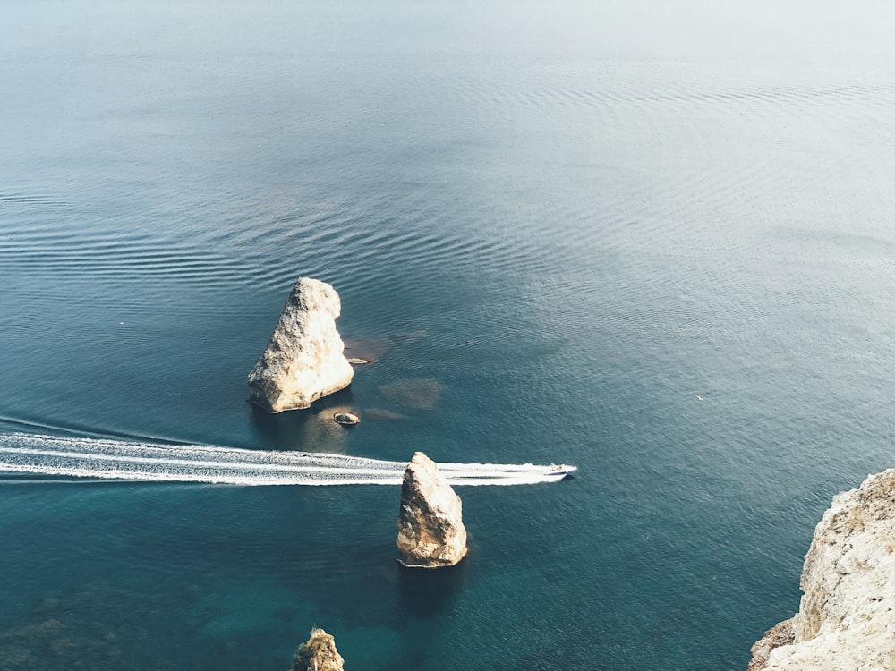 white stones and body of water