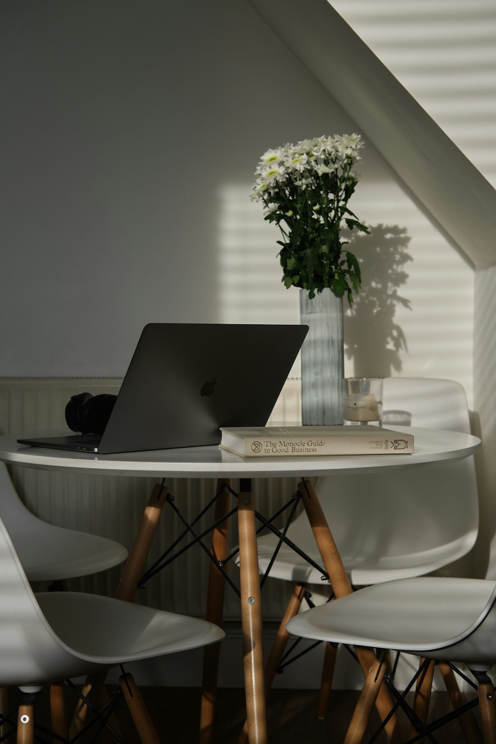 silver MacBook on table