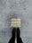 A pair of black boots standing on a concrete surface with a motivational message stenciled in yellow that reads 'Stand Here to Activate Your Super Powers'.