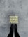 A pair of black boots standing on a concrete surface with a motivational message stenciled in yellow that reads 'Stand Here to Activate Your Super Powers'.