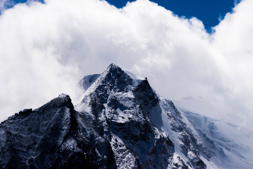 snowy mountain and clouds