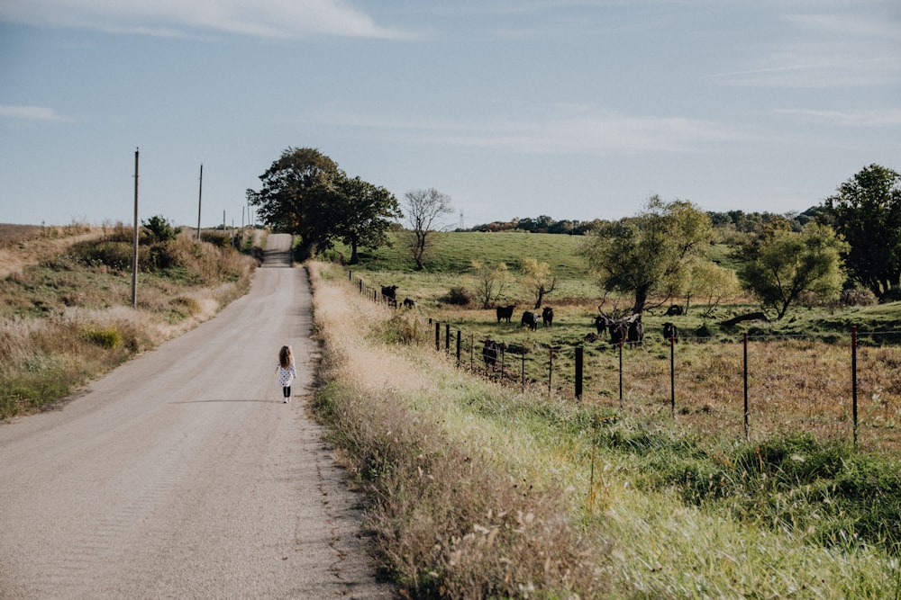 girl walking on the road