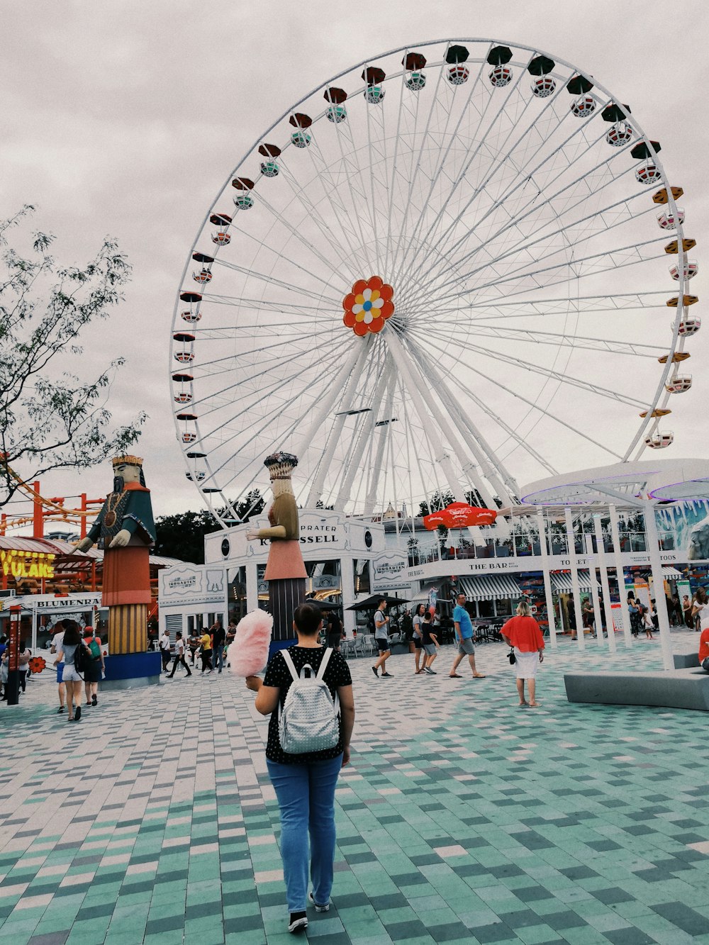 people in amusement park under white sky during daytime