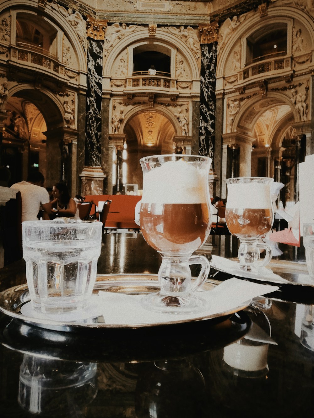 clear drinking glass on tray