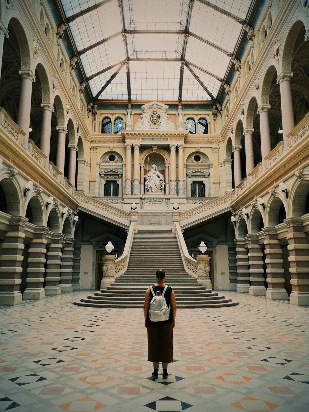 person standing inside Palace of Justice, Vienna