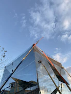Modern residential building under construction with clear blue sky