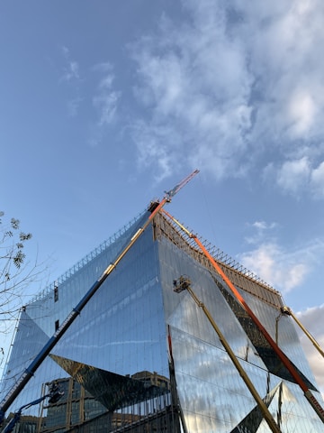 Modern residential building under construction with clear sky background