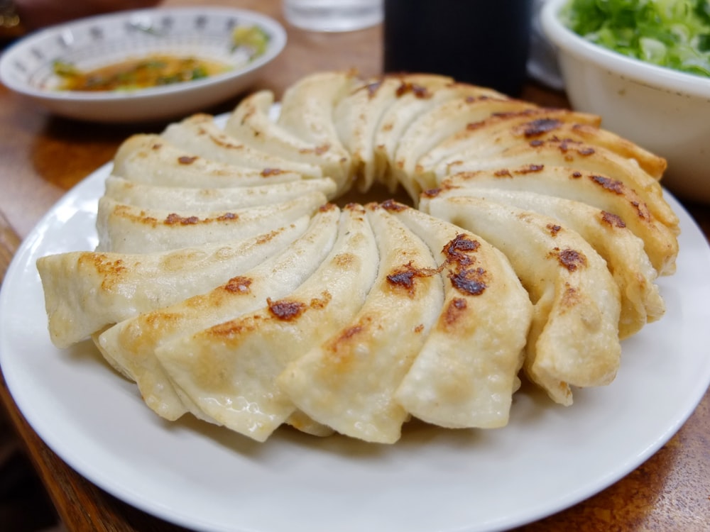 sliced pancake on round white ceramic plate