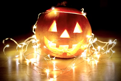 lighted string lights wrapped on jack-o'-lantern halloween google meet background