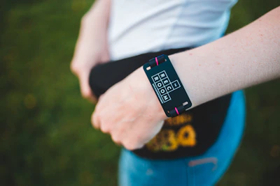 peson wearing black fitness tracker standing