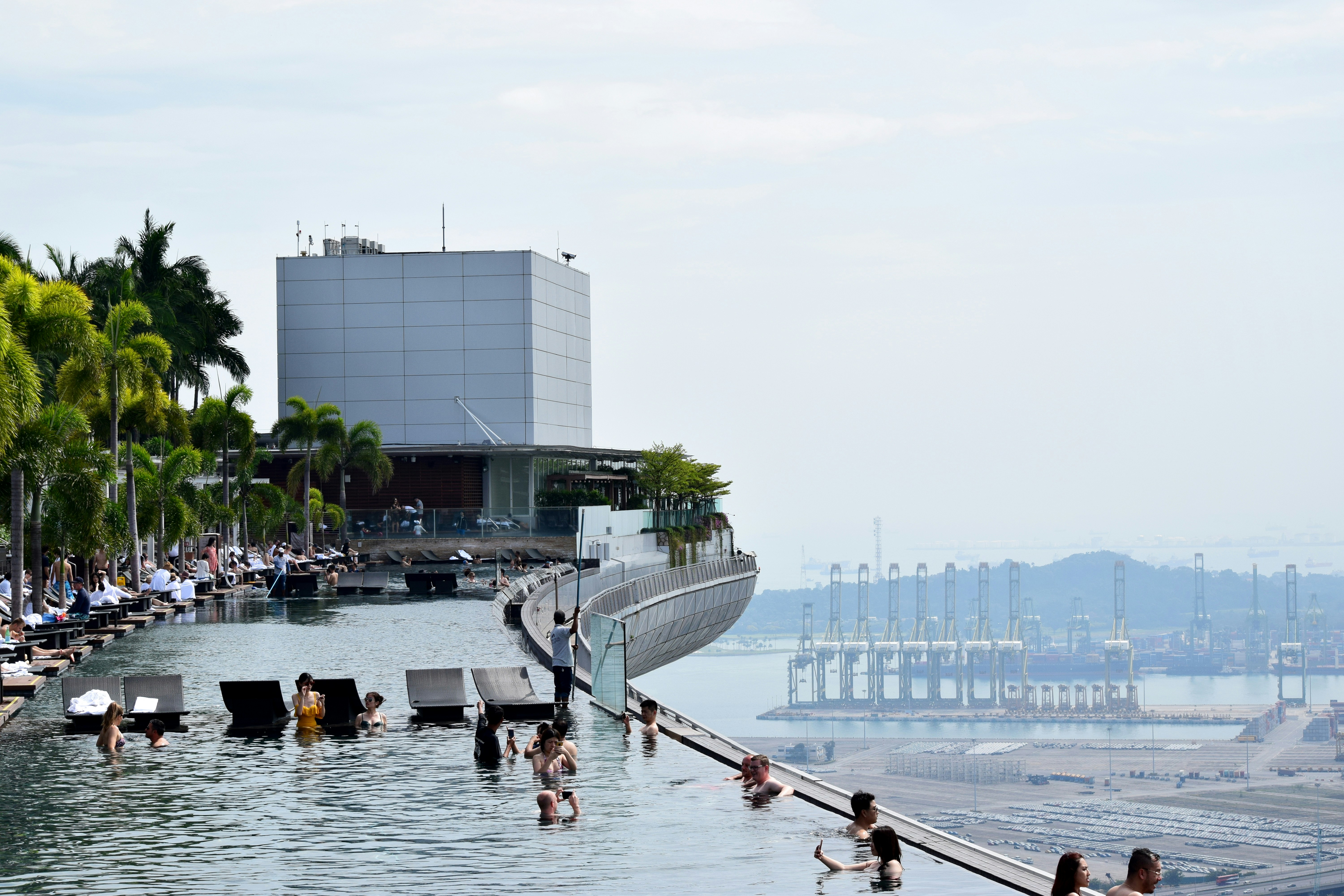 People enjoying the infinity pool at the top of Marina Bay Sands