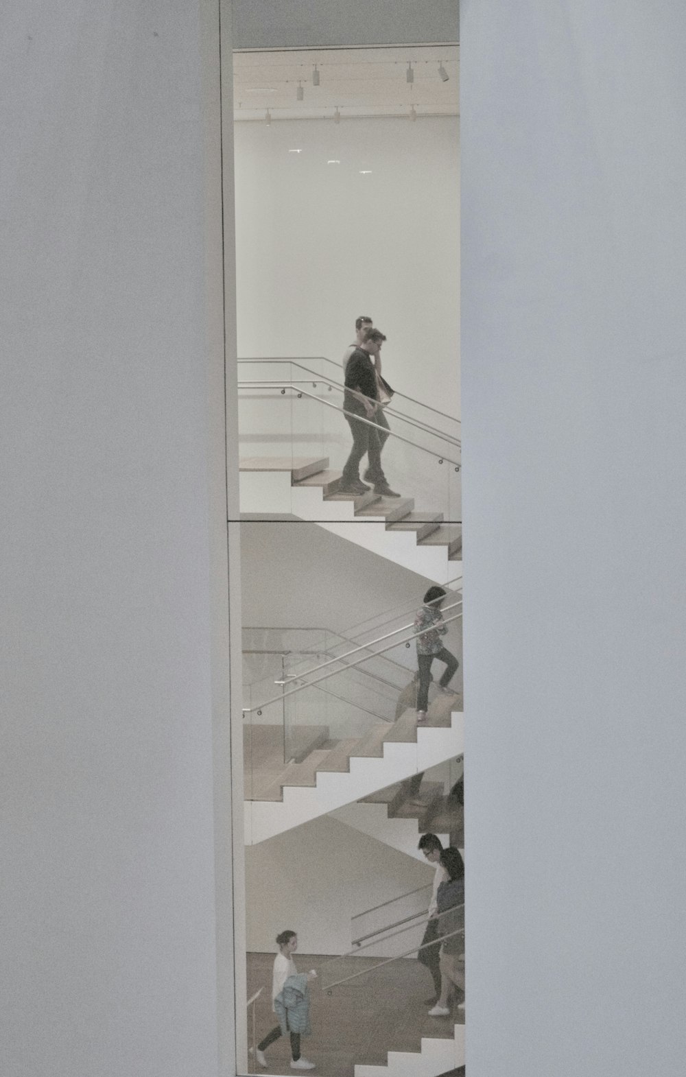 people walking on stairs inside building