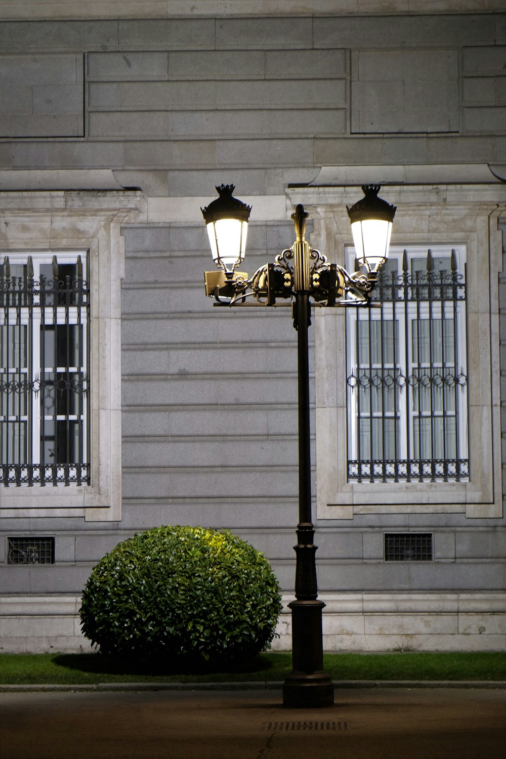 lamp post near gray house