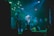 A band is performing on stage with three visible members playing electric guitars under vibrant green and blue stage lights. The atmosphere is energetic, with the audience barely visible in the darker areas, suggesting a lively concert.