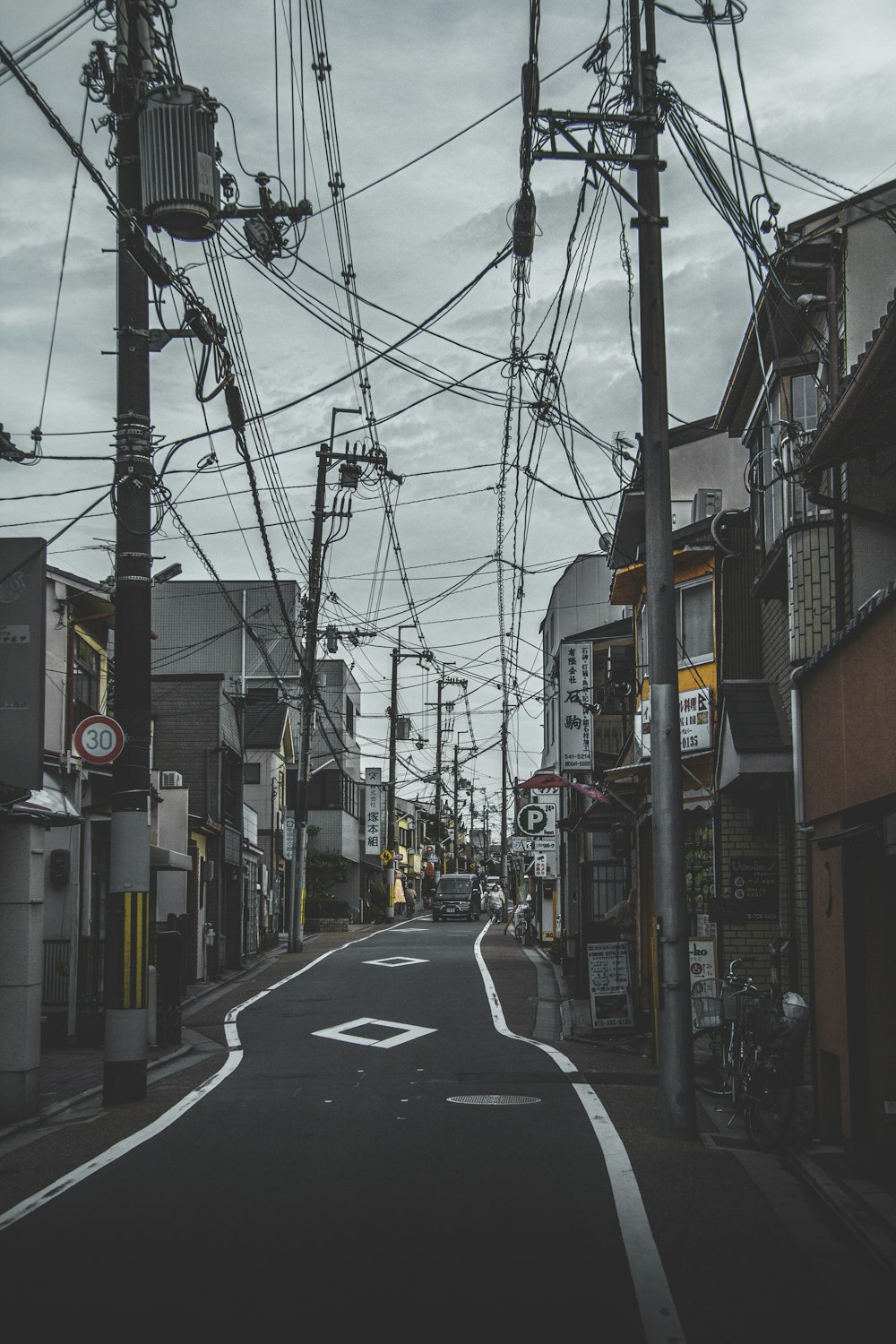 asphalt roadway surrounded by buildings