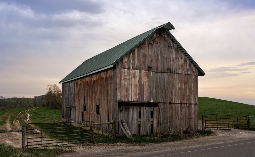 gray wooden warehouse during daytime