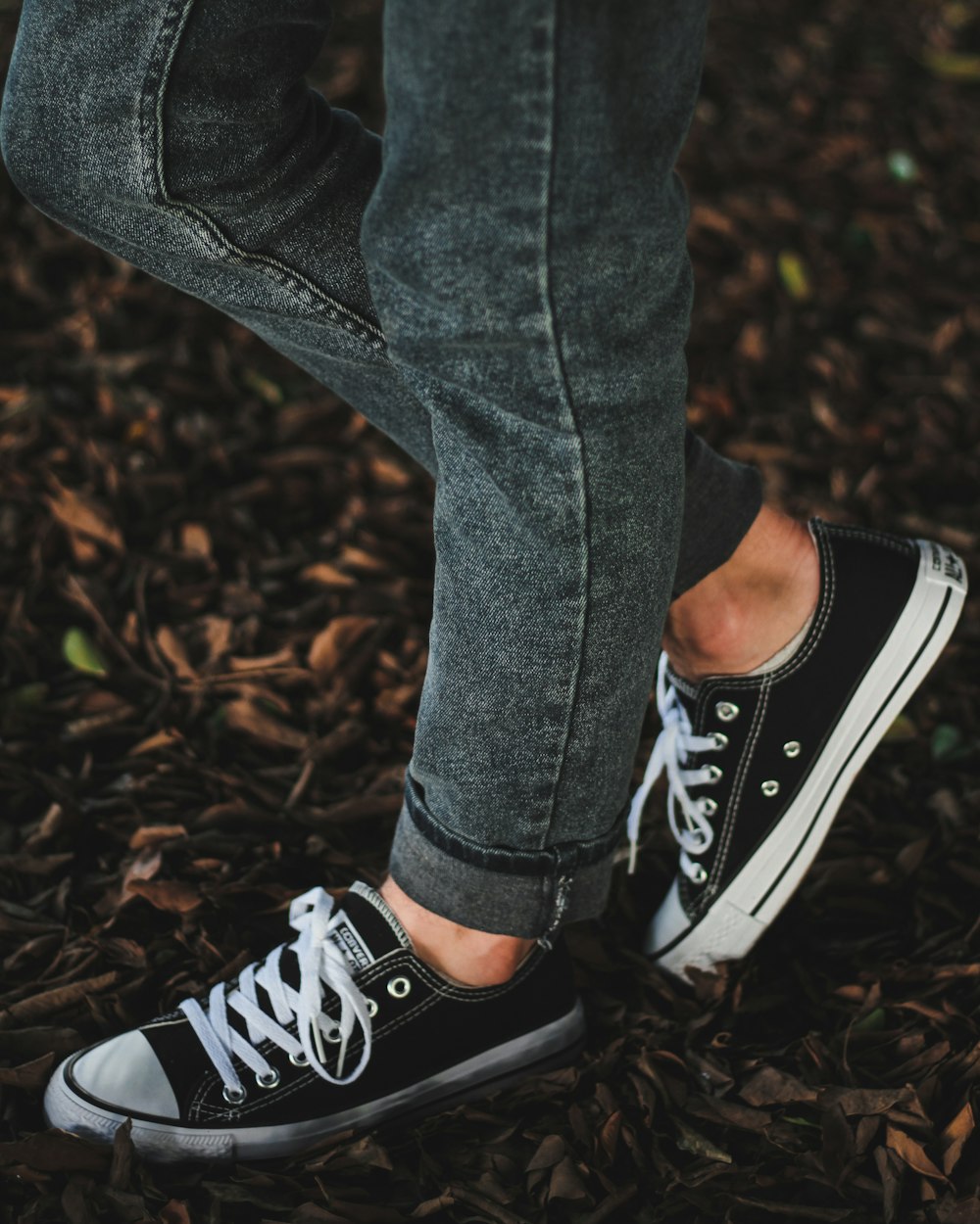 person wearing black-and-white Converse All-Star sneakers photo – Free Grey  Image on Unsplash