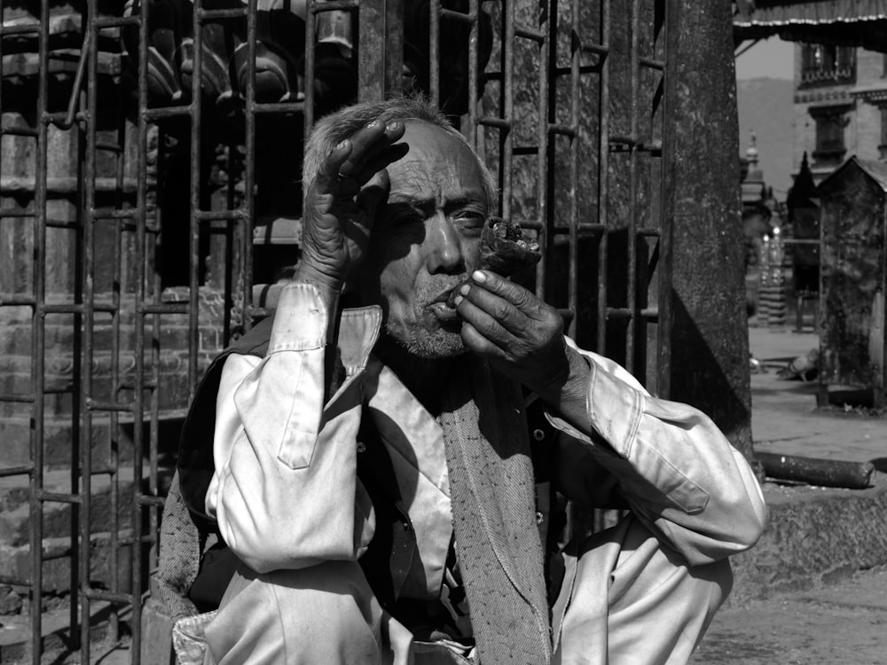 grayscale photography of man in shirt