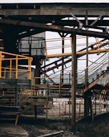 Completed steel structure with yellow safety railings and industrial equipment around