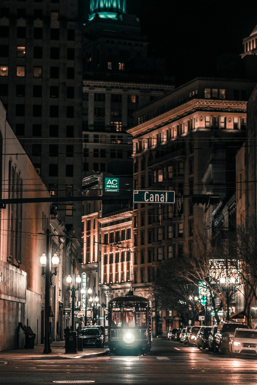 different vehicles on road near buildings during night time