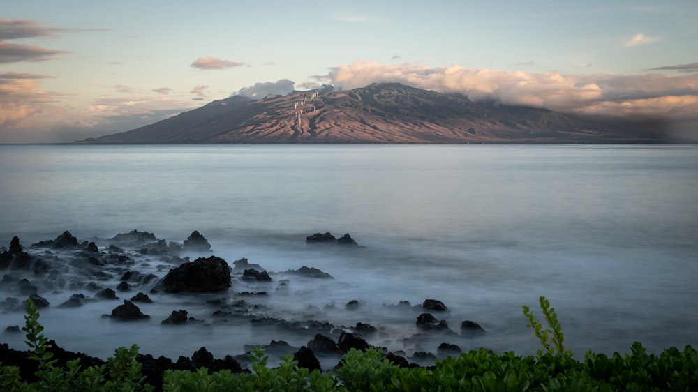 mountain near the body of water photograph