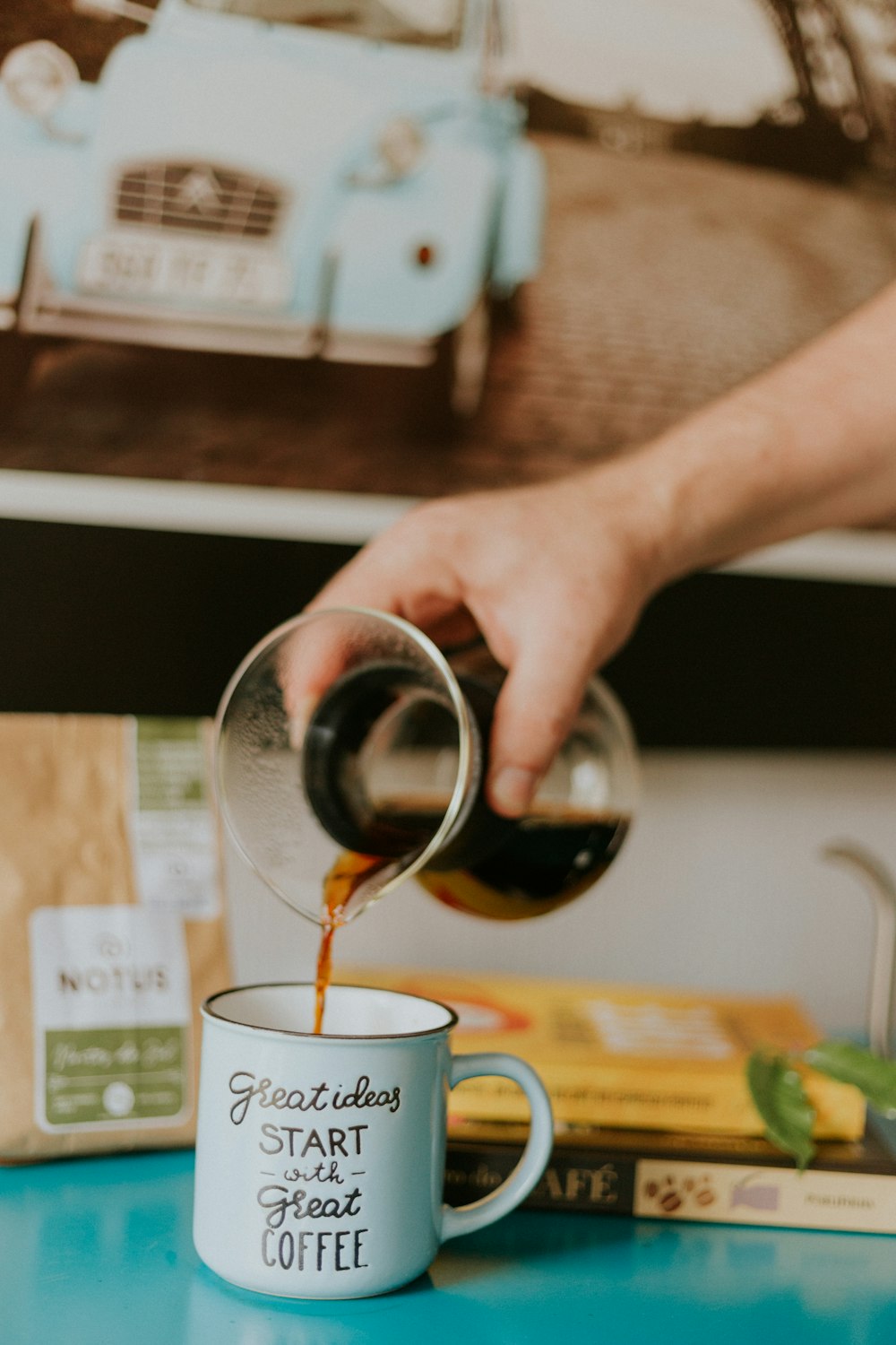 black liquid pouring in white mug