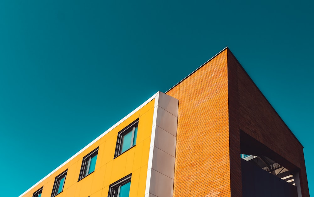 orange concrete building low angle photography